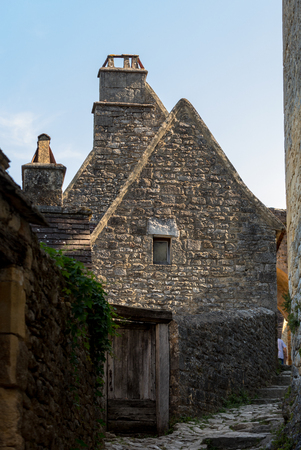 Typical French townscape with ancient housest and cobblestone street in the traditional town Beynac-et-Cazenac, Franceの写真素材
