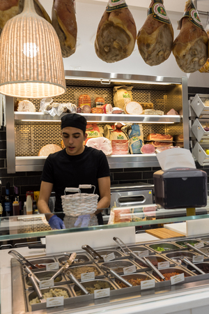 Ferrara, Italy - June 10, 2017: Inside small Italian food and mini market with  staff at work in Ferrara. Italyのeditorial素材