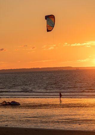 Saint-Malo, France - September 13, 2018: Sunset and Kitesurfers on the beach in Saint Malo,  Brittany, Franceのeditorial素材