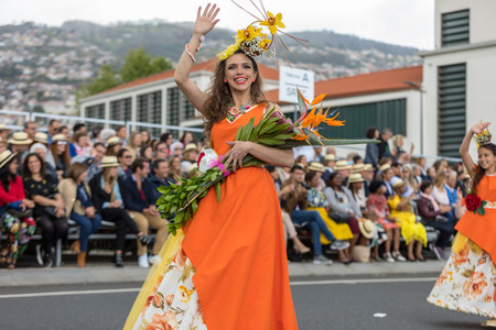 Funchal; Madeira; Portugal - April 22; 2018: Woman in a colorful costume at the Madeira Flower Festival Parade , Funchal, Madeira, Portugalのeditorial素材