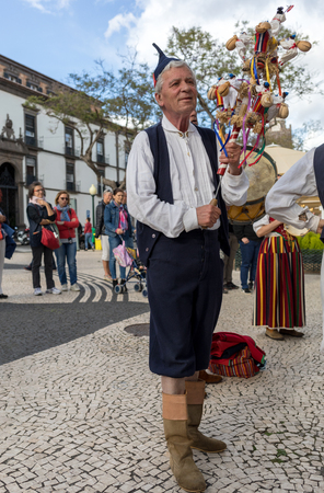 Funchal, Portugal - April 19, 2018:  Folk musicians and dancers performing on the Avenida Arriaga  in Funchal on the Madeira Island, Portugal.のeditorial素材