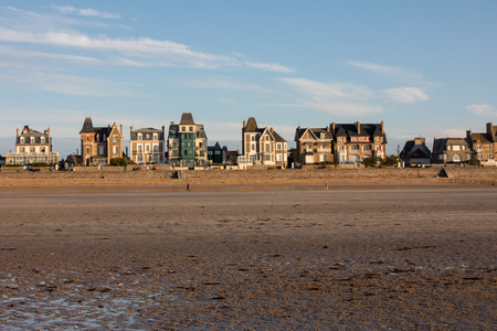 St Malo, France - September 16, 2018: Beach in the evening sun and buildings along the seafront promenade in Saint Malo. Brittany, Franceのeditorial素材