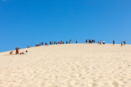 Dune of Pilat, France - September 10,2018: People on the Dune of Pilat, the tallest sand dune in Europe. La Teste-de-Buch, Arcachon Bay, Aquitaine, Franceのeditorial素材