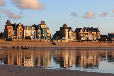 St Malo, France - September 14, 2018: Beach in the evening sun and buildings along the seafront promenade in Saint Malo. Brittany, Franceのeditorial素材