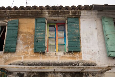 Old  stone house with  wooden shutters in  Provence, France.の写真素材