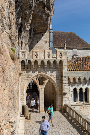 Rocamadour, France - September 3, 2018: Stone walls of historic Basilica of St-Sauveur blend into the cliff in Rocamadour, Franceのeditorial素材