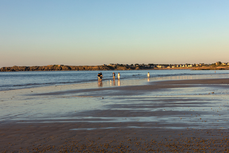 St Malo, France - September 16, 2018: Romantic walk of people before sunset on the picturesque beach of Saint Malo. Brittany, Franceのeditorial素材