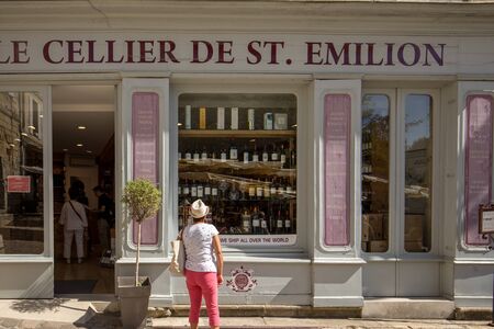 Saint Emilion, France - September 8, 2018: Exterior of a wine shop in Saint Emilion in France. St Emilion is one of the principal red wine areas of Bordeaux and very popular tourist destination.のeditorial素材