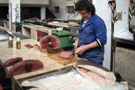 Funchal, Madeira, Portugal - April 23, 2018: Fish sellers at Mercado dos Lavradores, the famous fish and seafood market of Funchal, the capital of Madeira islandFish sellers at Mercado dos Lavradores, the famous fish and seafood market of Funchal, the capのeditorial素材