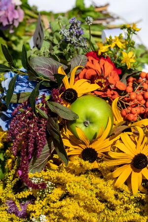 Floristic bouquet of flowers, herbs and fruits that are the symbol of summerの写真素材