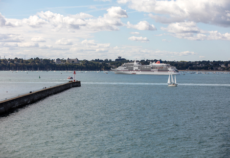 St Malo, France - September 14, 2018: View from the ramparts at the pier Mole des Noire,  lighthouse, ferry and the town of Dinard. Saint Malo, Brittany, Franceのeditorial素材