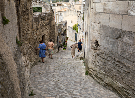 Les Baux de Provence, France - June 26, 2017: Street in medieval village of  Les Baux de Provence. Les Baux is now given over entirely to the tourist trade, relying on a reputation as one of the most picturesque villages in Franceのeditorial素材