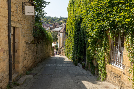 Sarlat, France - September 2, 2018: Historic houses along Montagne street in  Sarlat la Caneda in Dordogne Department, Aquitaine, Franceのeditorial素材