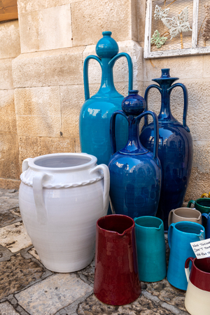 Polignano a Mare, Italy - September 17, 2019: Hand-painted colorful traditional ceramics at a shop display in Polignano a Mare. Apulia. Italyのeditorial素材