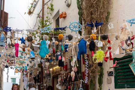Polignano a Mare, Italy - September 17, 2019: Store display with handmade souvenirs in Polignano a Mare. Apulia, Bari province, Italy,のeditorial素材