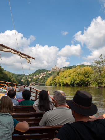 Castelnaud, Dordogne, France - September 7, 2018: A tourist boat, in French called gabare, on the river Dordogne at Castelnaud la Chapelle, Aquitaine, Franceのeditorial素材