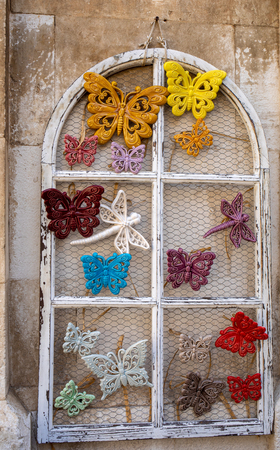 Polignano a Mare, Italy - September 17, 2019: Hand-painted colorful ceramic butterflies at the shop display in Polignano a Mare. Apulia. Italyのeditorial素材