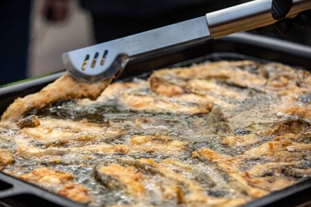 Delicious carp fillets roasted in the frying panの写真素材