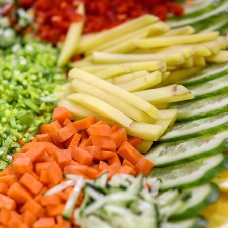 Different raw shredded vegetables and fruits as an example of a healthy dietの写真素材