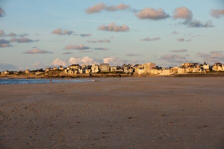 St Malo, France - September 14, 2018: Beach in the evening sun and buildings along the seafront promenade in Saint Malo. Brittany, Franceのeditorial素材
