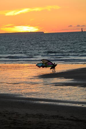 Saint-Malo, France - September 13, 2018: Sunset and Kitesurfers on the beach in Saint Malo,  Brittany, Franceのeditorial素材