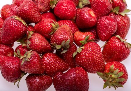 fresh ripe strawberries isolated on white background の写真素材