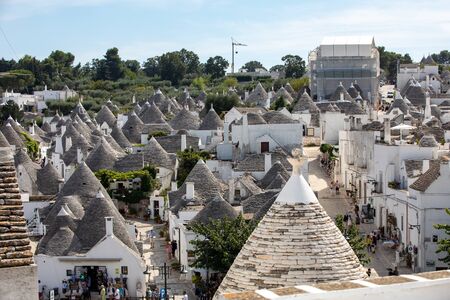 Alberobello, Italy - September 16, 2019: Tradtional white houses in Trulli village. Alberobello, Italy. The style of construction is specific to the Murge area of the Italian region of Apulia (in Italian Puglia). Made of limestone and keystone.のeditorial素材