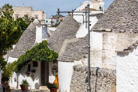 Alberobello, Italy - September 16, 2019: Tradtional white houses in Trulli village. Alberobello, Italy. The style of construction is specific to the Murge area of the Italian region of Apulia (in Italian Puglia). Made of limestone and keystone.のeditorial素材