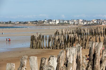 St Malo, France - September 15, 2018: Romantic walk of people on the picturesque beach of Saint Malo. Brittany, Franceのeditorial素材