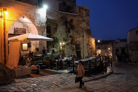 Matera, Italy - September 14, 2019: Evening view of the city of Matera, Italy, with the colorful...