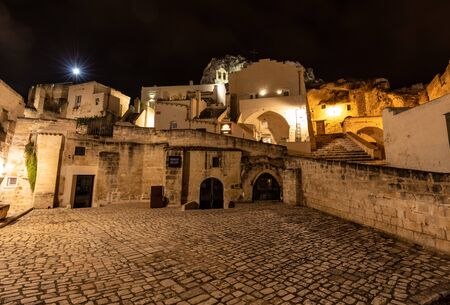 Matera, Italy - September 19, 2019: Night landscape of the Sassi of Matera a historic district iin...