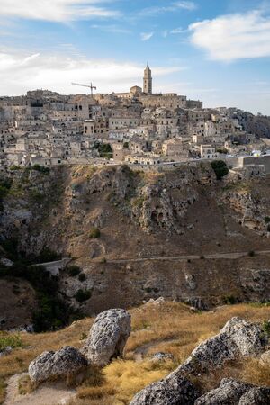 Panoramic view of Sassi di Matera a historic district in the city of Matera, well-known for their ancient cave dwellings from the Belvedere di Murgia Timone,  Basilicata, Italyの写真素材