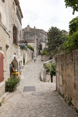 Les Baux de Provence, France - June 26, 2017: Street in medieval village of  Les Baux de Provence. Les Baux is now given over entirely to the tourist trade, relying on a reputation as one of the most picturesque villages in Franceのeditorial素材