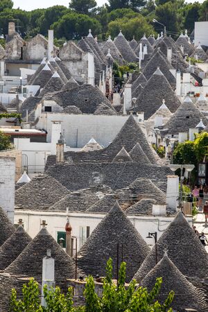 Alberobello, Italy - September 16, 2019: Tradtional white houses in Trulli village. Alberobello, Italy. The style of construction is specific to the Murge area of the Italian region of Apulia (in Italian Puglia). Made of limestone and keystone.のeditorial素材