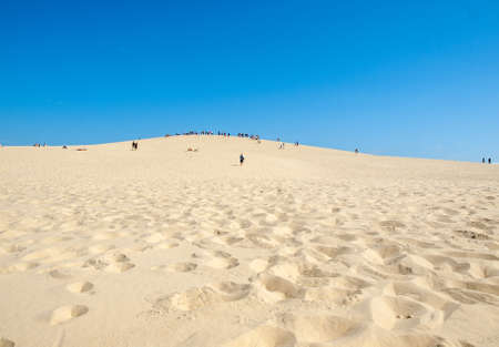 Dune of Pilat, France - September 10,2018: People on the Dune of Pilat, the tallest sand dune in Europe. La Teste-de-Buch, Arcachon Bay, Aquitaine, Franceのeditorial素材