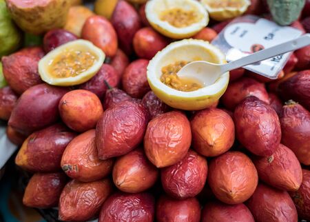 Passion fruits for sale in the market の写真素材