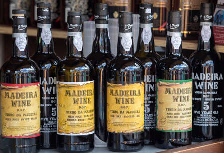 Funchal, Madeira, Portugal - April 19, 2018: Bottles of Madeira Wine at a street market stall in Funchal, Madeira. Portugal.のeditorial素材