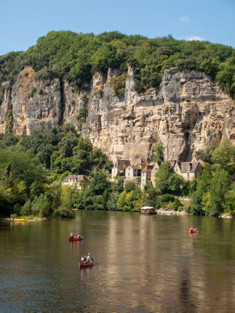 La Roque-Gageac, Dordogne, France - September 7, 2018: Canoeing and tourist boat, in French called gabare, on the river Dordogne at La Roque-Gageac, Aquitaine, Franceのeditorial素材