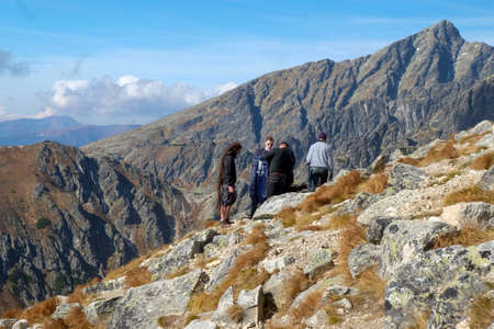 Vysoke Tatry, Slovakia - October 10, 2018: Hikers on trail at Great Cold Valley, Vysoke Tatry (High Tatras), Slovakia. The Great Cold Valley is 7 km long valley, very attractive for touristsのeditorial素材