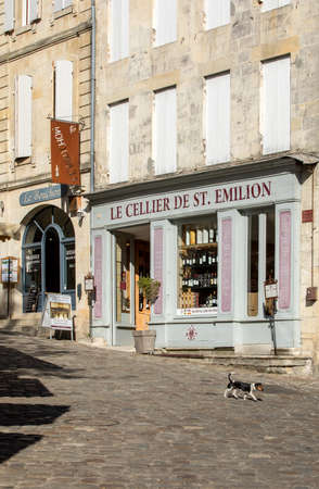 Saint Emilion, France - September 11, 2018: Exterior of a wine shop in Saint Emilion in France. St Emilion is one of the principal red wine areas of Bordeaux and very popular tourist destination.のeditorial素材