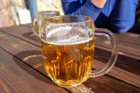 Vysoke Tatry, Slovakia - October 10, 2018: A glass of cold Czech beer while resting in a mountain...