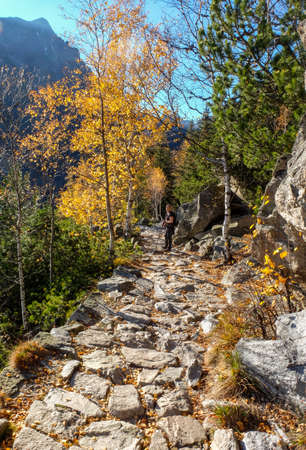 Vysoke Tatry, Slovakia - October, 2018: Hikers on trail at Great Cold Valley, Vysoke Tatry (High Tatras), Slovakia. The Great Cold Valley is 7 km long valley, very attractive for touristsのeditorial素材