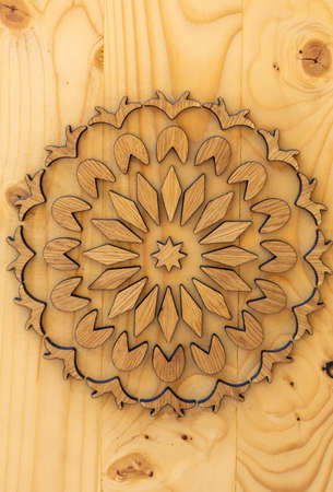 Wygiezlow, Poland - August 14, 2020: Floral motifs carved on wooden board by a folk artist in open-air museum Nadwislanski Ethnographic Park in Wygiezlow. Polandのeditorial素材