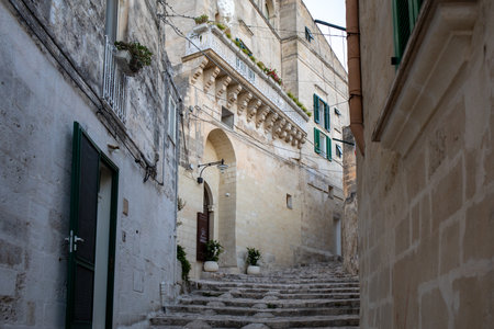 Matera, Italy - September 14, 2019: Cobblestone street in the Sassi di Matera a historic district in the city of Matera. Basilicata. Italyのeditorial素材
