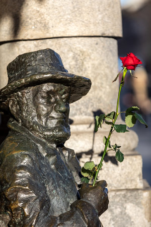 Cracow, Poland - December 10, 2017: Monument to Piotr Skrzynecki from famous Piwnica Pod Baranami cabaret in Cracow. Polandのeditorial素材