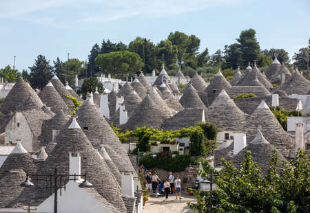 Alberobello, Italy - September 16, 2019: Tradtional white houses in Trulli village. Alberobello, Italy. The style of construction is specific to the Murge area of the Italian region of Apulia (in Italian Puglia). Made of limestone and keystone.のeditorial素材