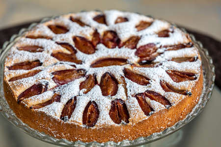 Delicious plum cake sprinkled with powdered sugar