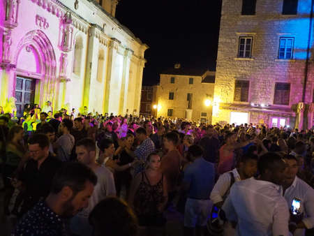 Sibenik, Croatia- July 7, 2017: Dancing crowd of people at Salsa Beach Splash Festival in Sibenikのeditorial素材