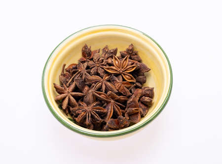 Star anise in a vintage ceramic bowlの写真素材