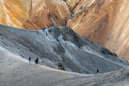 Landmannalaugar, Iceland - July 30, 2017: Hikers in volcanic mountains of Landmannalaugar in Fjallabak Nature Reserve. Icelandのeditorial素材